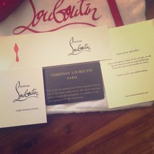 Christian Louboutin spiked red flats